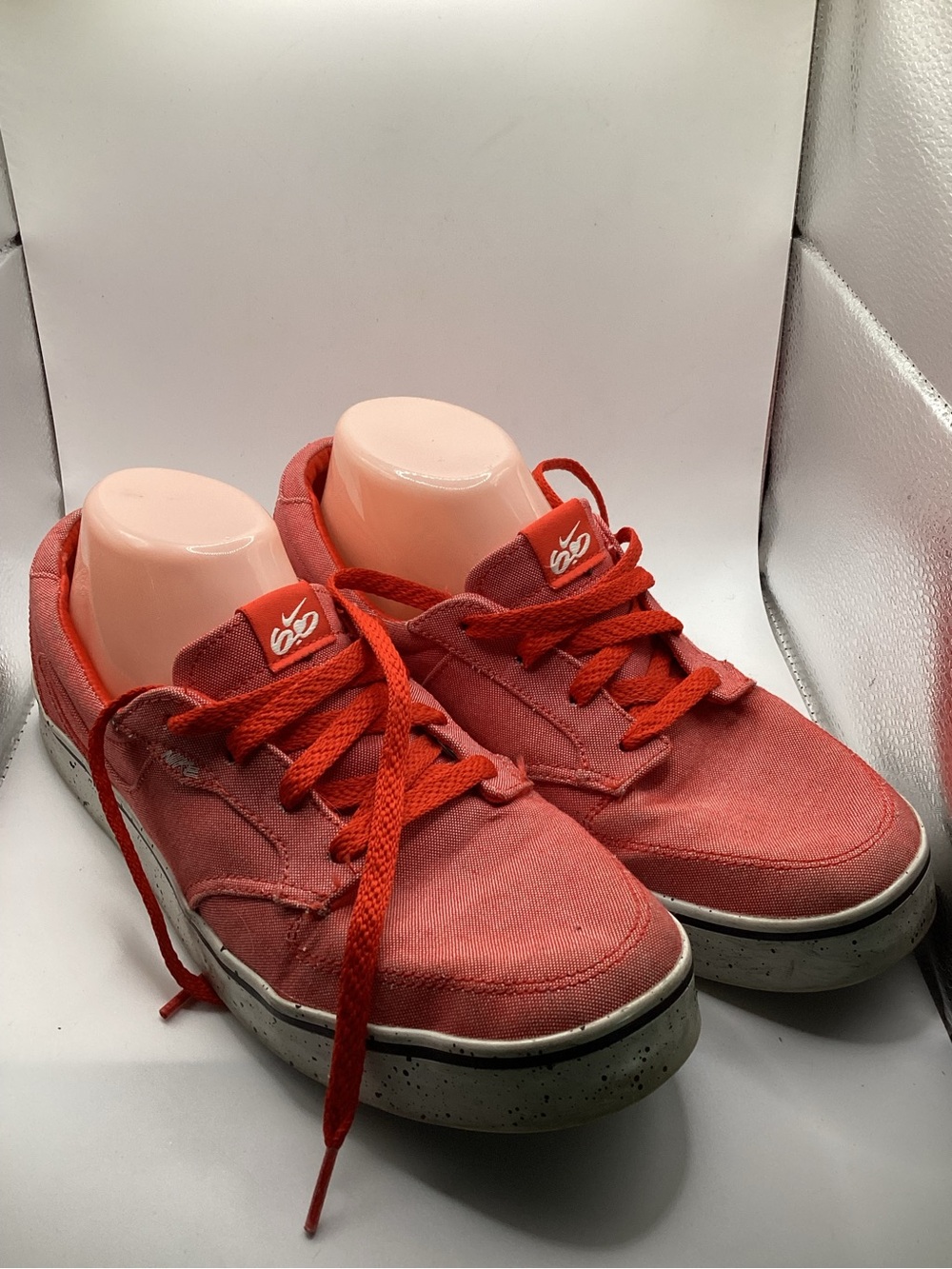 Nike 6.0 skate shoes featuring a vibrant red canvas upper and a speckled midsole